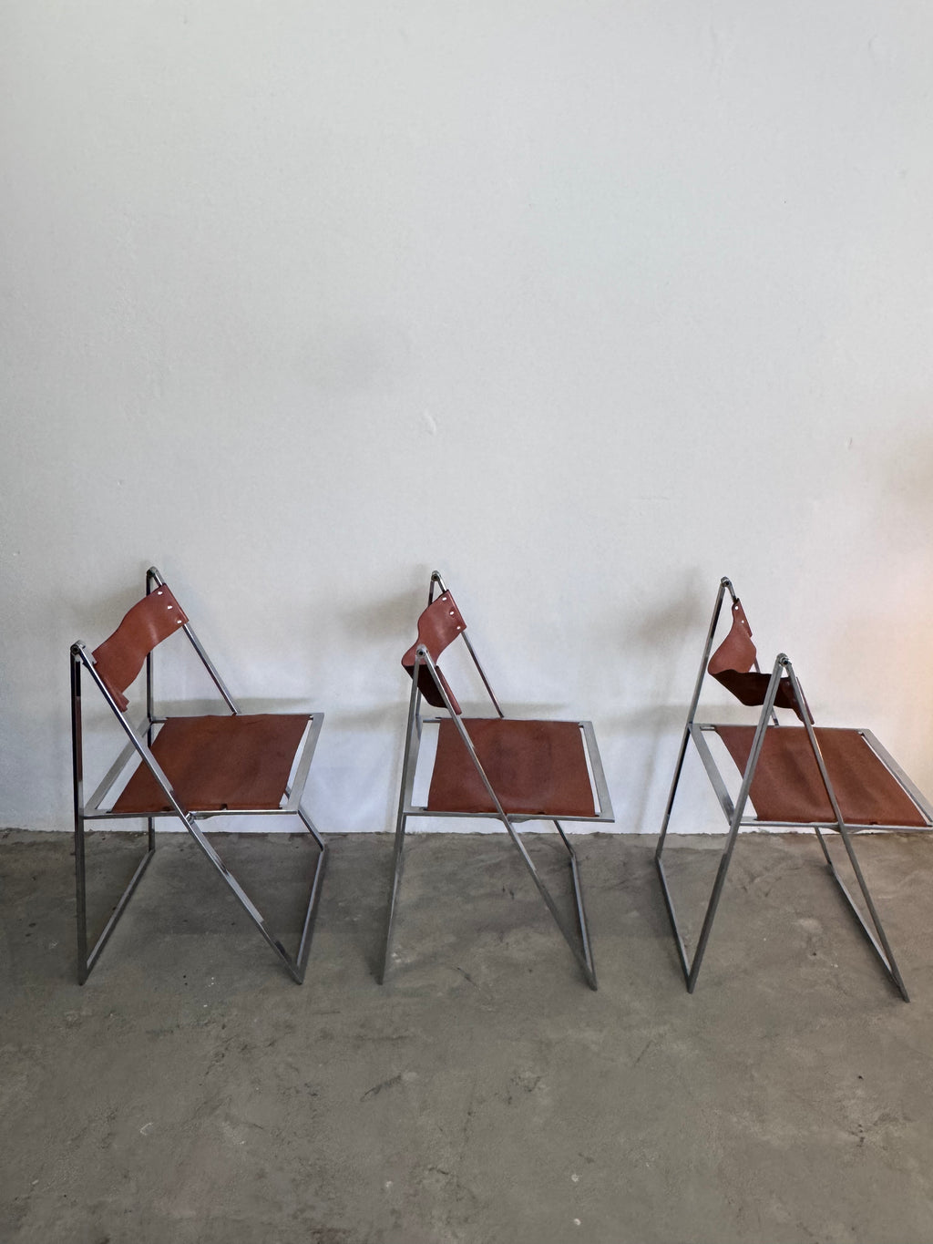 Vintage „Elios“ Klappstühle von Fontoni  Geraci für Lübke Cognac Sattelleder & Chrom – Mid-Century Modern – Restauriert